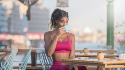 Boost energy and burn fat naturally—a fitness-focused woman enjoying her morning cup of Beneve Xcelerate Coffee.